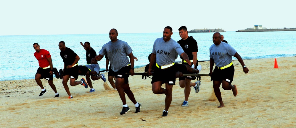 Headquarters and Headquarters Company, 10th Regional Support Group soldiers enjoy a competitive day at the beach