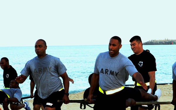 Headquarters and Headquarters Company, 10th Regional Support Group soldiers enjoy a competitive day at the beach