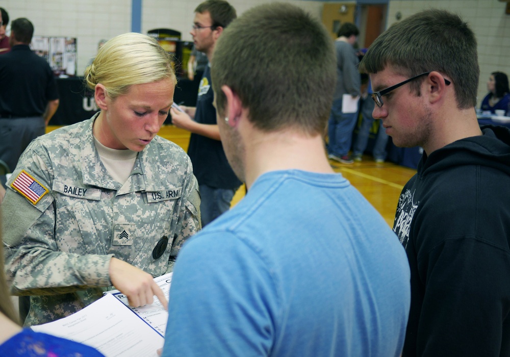 Indiana National Guard Recruiter of the Year, Sgt. Brooke Bailey, speaks with students about the benefits the National Guard offers at a career fair in Muncie, Ind. Sgt. Bailey is the first female recruiter to be named &quot;Recruiter of the Year&quot; in Indiana.