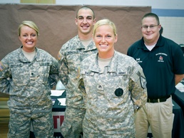 Indiana National Guard Recruiter of the Year, Sgt. Brooke Bailey, poses with fellow recruiters at a career fair in Muncie, Ind. Sgt. Bailey is the first female recruiter to be named &quot;Recruiter of the Year&quot; in Indiana. - Photo by Army 1st Lt. Brian Weitzei
