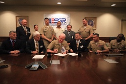 MARFORRES commander Lt. Gen. Richard P. Mills signs statement of support for the Guard and Reserve