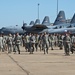 Airman and civilian employees, perform a Foreign Object Debris (FOD) Walk