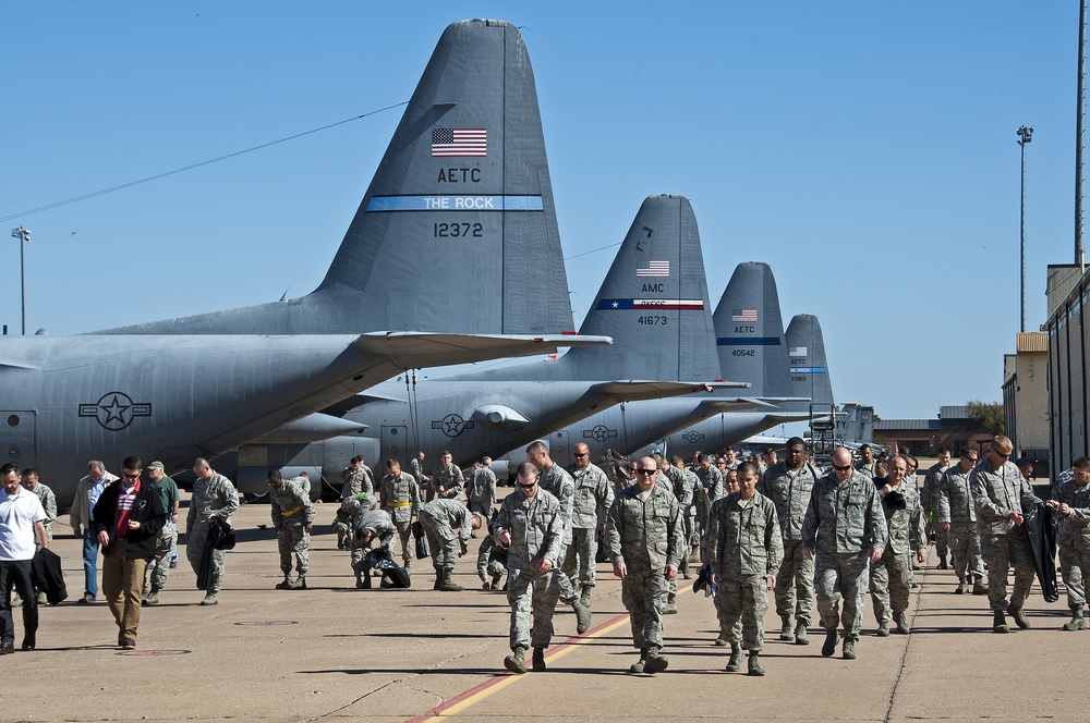 Airman and civilian employees, perform a Foreign Object Debris (FOD) Walk