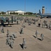 Airman and civilian employees, perform a Foreign Object Debris (FOD) Walk