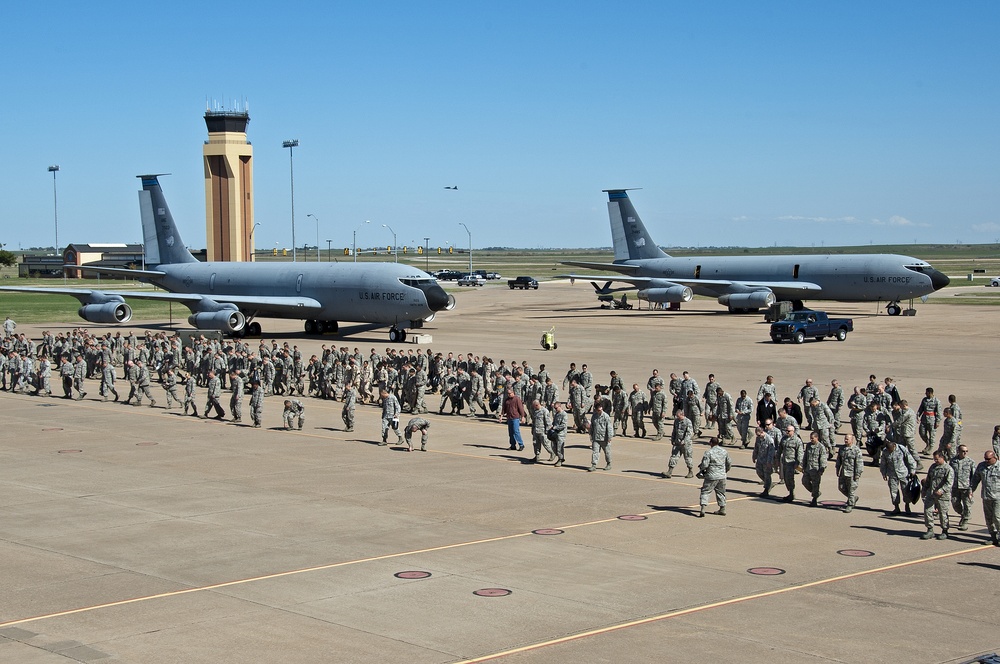 Airman and civilian employees, perform a Foreign Object Debris (FOD) Walk