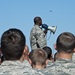 Airman and civilian employees, perform a Foreign Object Debris (FOD) Walk