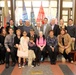 WWII Veteran poses for a photo with his family before award ceremony