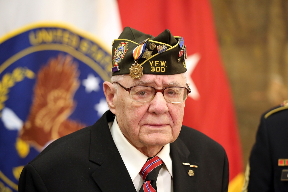 US Army WWII veteran takes in a moment