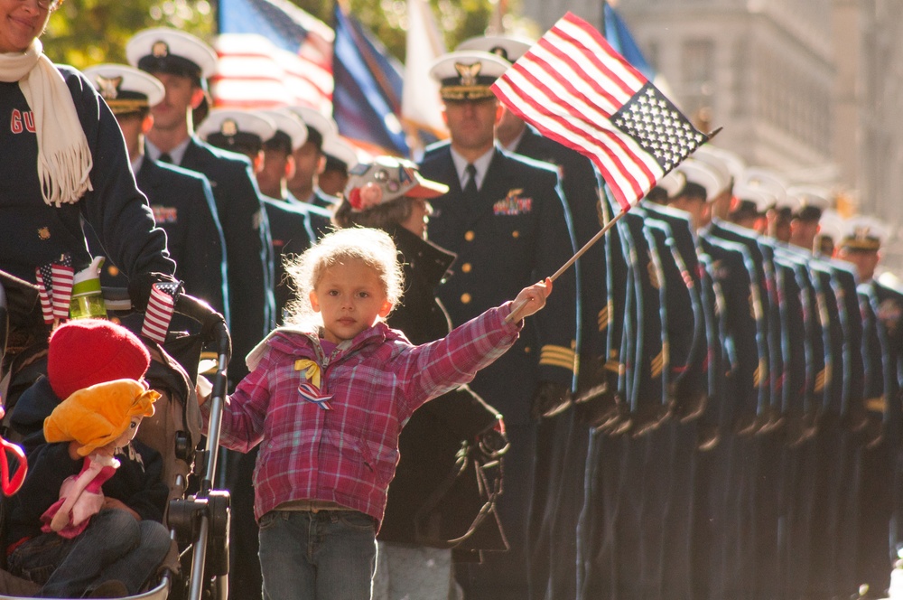 US Coast Guard families and service members march in New York City's Veterans Day Parade