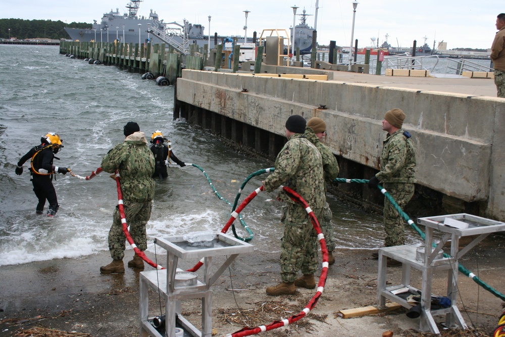 Underwater Construction Team ONE Dive Detachment Bravo performs underwater boat ramp repairs aboard Joint Expeditionary Base Little Creek-Fort Story