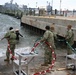 Underwater Construction Team ONE Dive Detachment Bravo performs underwater boat ramp repairs aboard Joint Expeditionary Base Little Creek-Fort Story