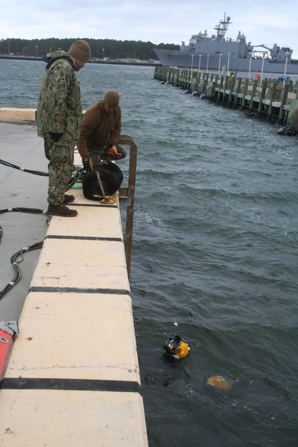 Underwater Construction Team ONE Dive Detachment Bravo performs underwater boat ramp repairs aboard Joint Expeditionary Base Little Creek-Fort Story