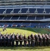 Service members pose for armed forces group photo before NFL game