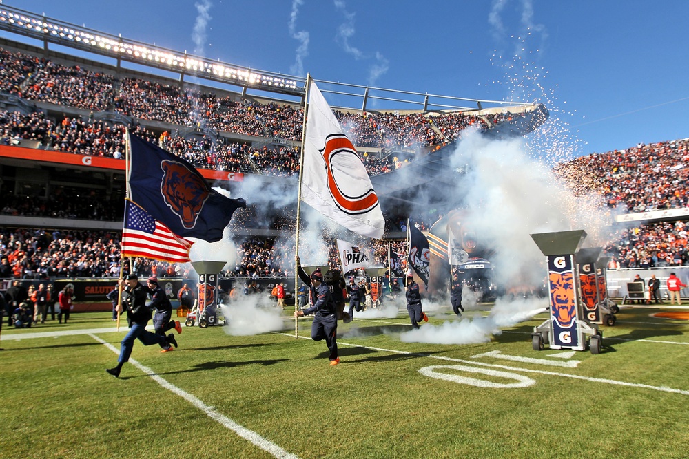 Army Reserve soldier leads Chicago Bears onto the field during game