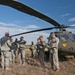Air Assault School cadre and pilots with 227th Aviation Regiment prep for sling load testing