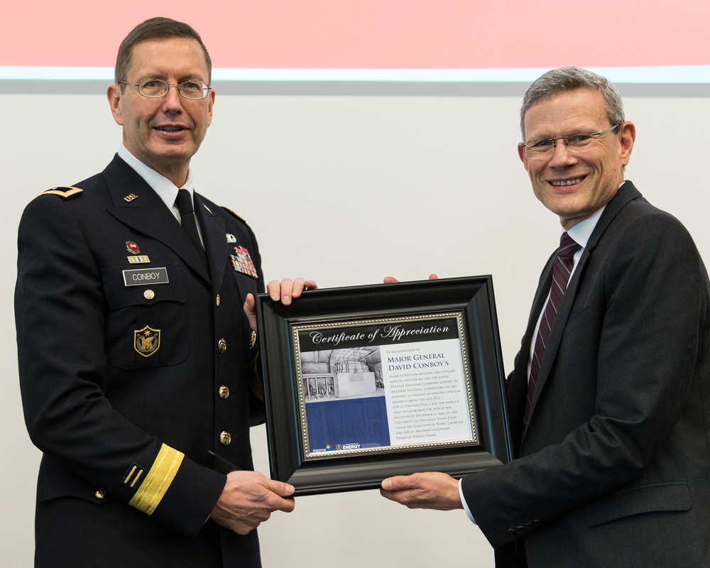 Paul Kerns presents Maj. Gen. David Conboy with a plaque