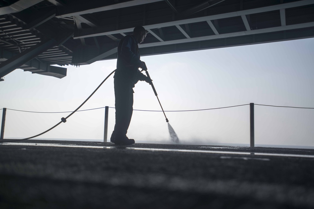 Washing the deck