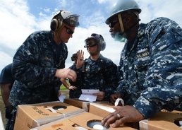 USS Mustin sailors provide aid during Operation Damayan