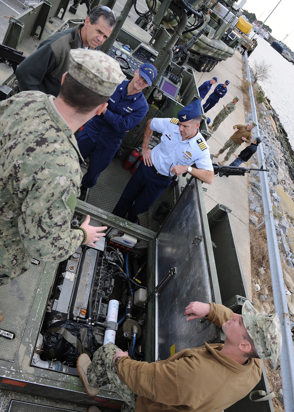 US Coast Guard liaison officers during a visit to Navy Expeditionary Combat Command