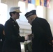 U.S. Marine Brig. Gen. Lori E. Reynolds shakes the oldest Marine presents hand at the Marine Corps birthday pageant