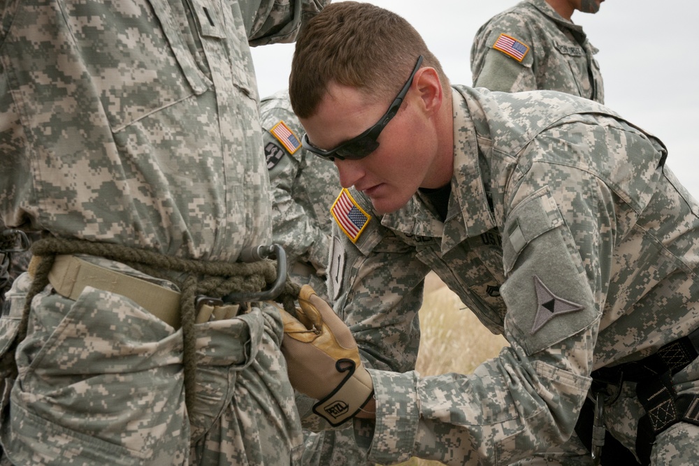 Fort Hood Air Assault School instructor inspects harnesses