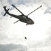 Air assault students rappel out of a UH-60 Black Hawk