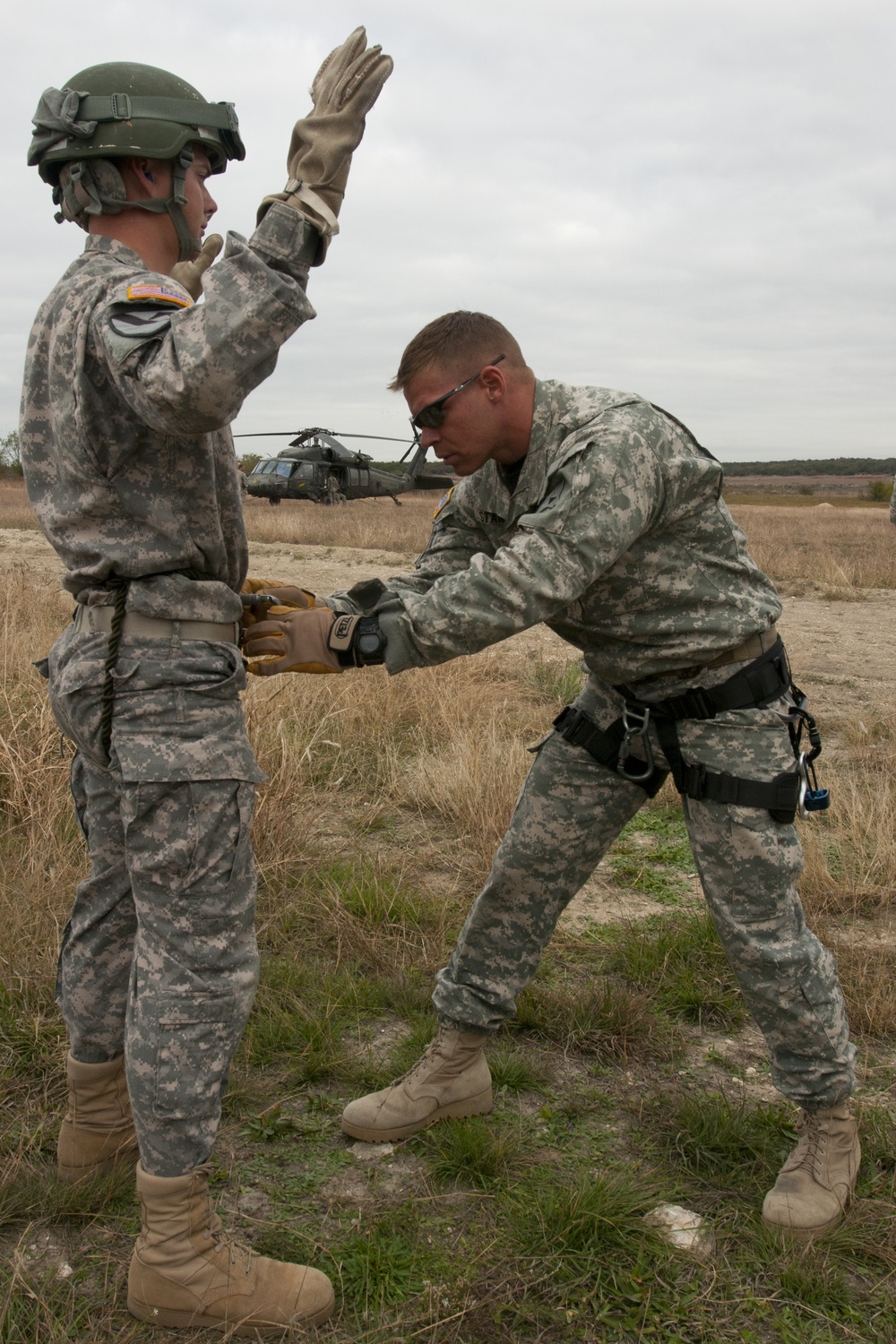 Air Assault School instructor inspects harnesses