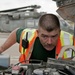 Joint inspections supervisor checks Humvee engine