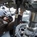 Naval airman conducts maintenance on helicopter