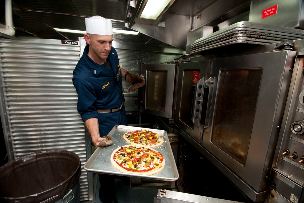 Sailor prepares pizzas