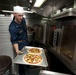 Sailor prepares pizzas