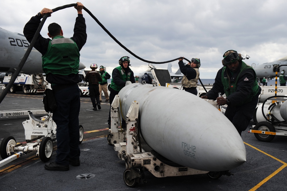 USS George H.W. Bush sailors move fuel tank