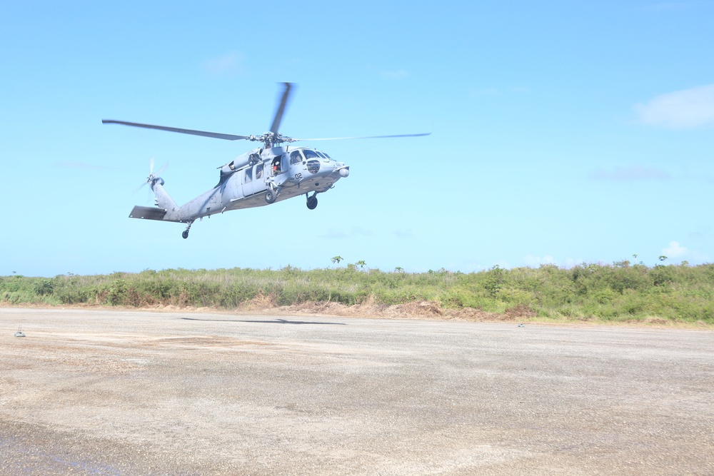 Navy Seahawk lands at Tinian North Field