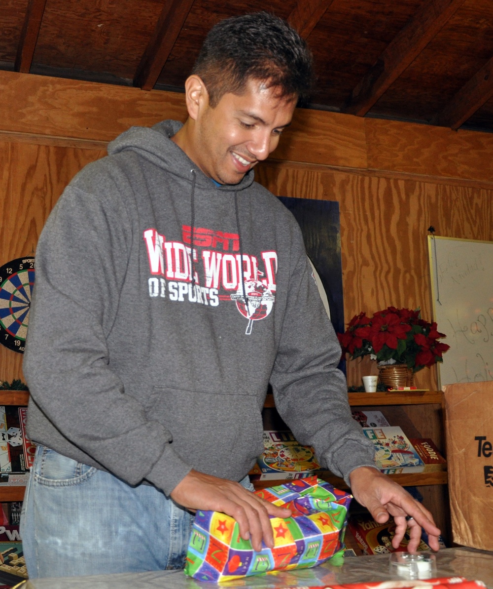 Joint Task Force-Bravo volunteers wrap holiday gifts for local orphans
