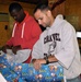 Joint Task Force-Bravo volunteers wrap holiday gifts for local orphans