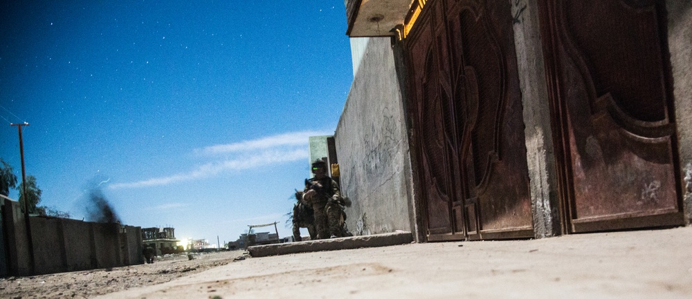 Coalition force members provide security during Helmand province operation