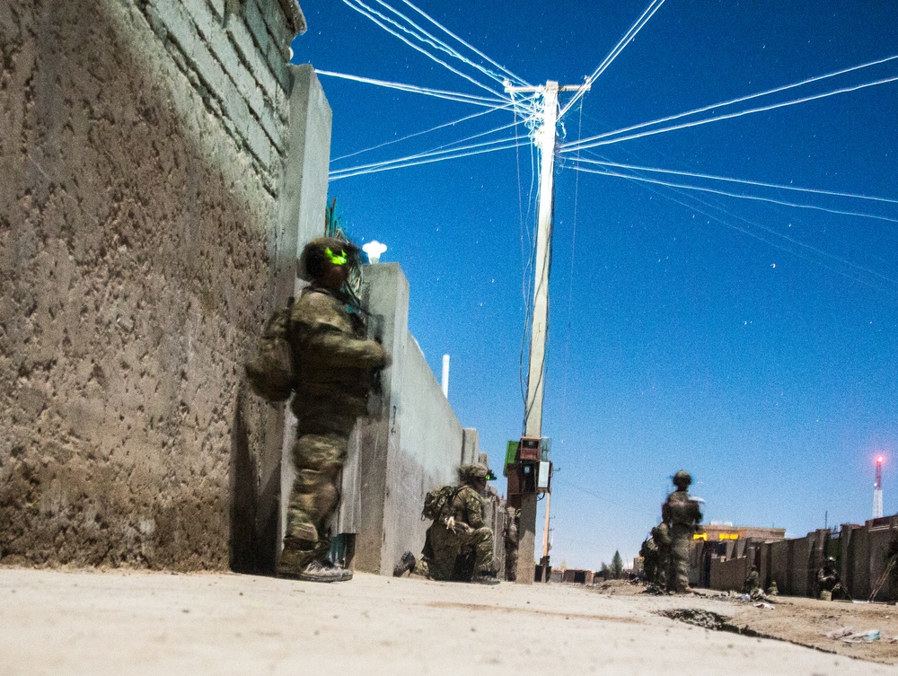 Coalition force members provide security during Helmand province operation