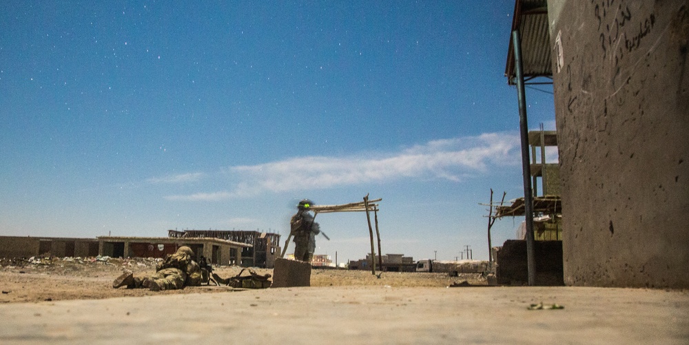 Coalition force members provide security during Helmand province operation