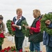 Volunteers place Christmas wreaths at veterans cemetery