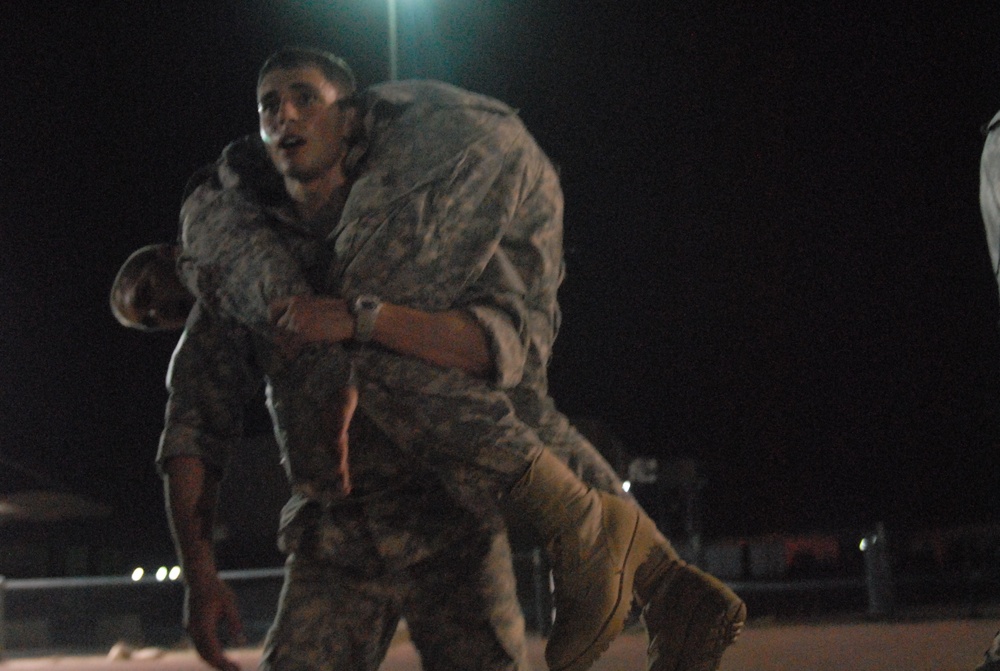 Soldiers at Camp Arifjan wrestle with Marine Corps style combatives