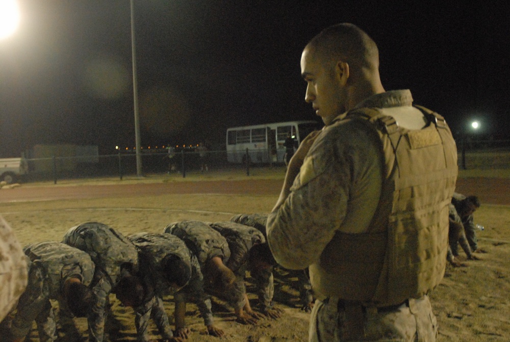 Soldiers at Camp Arifjan wrestle with Marine Corps style combatives