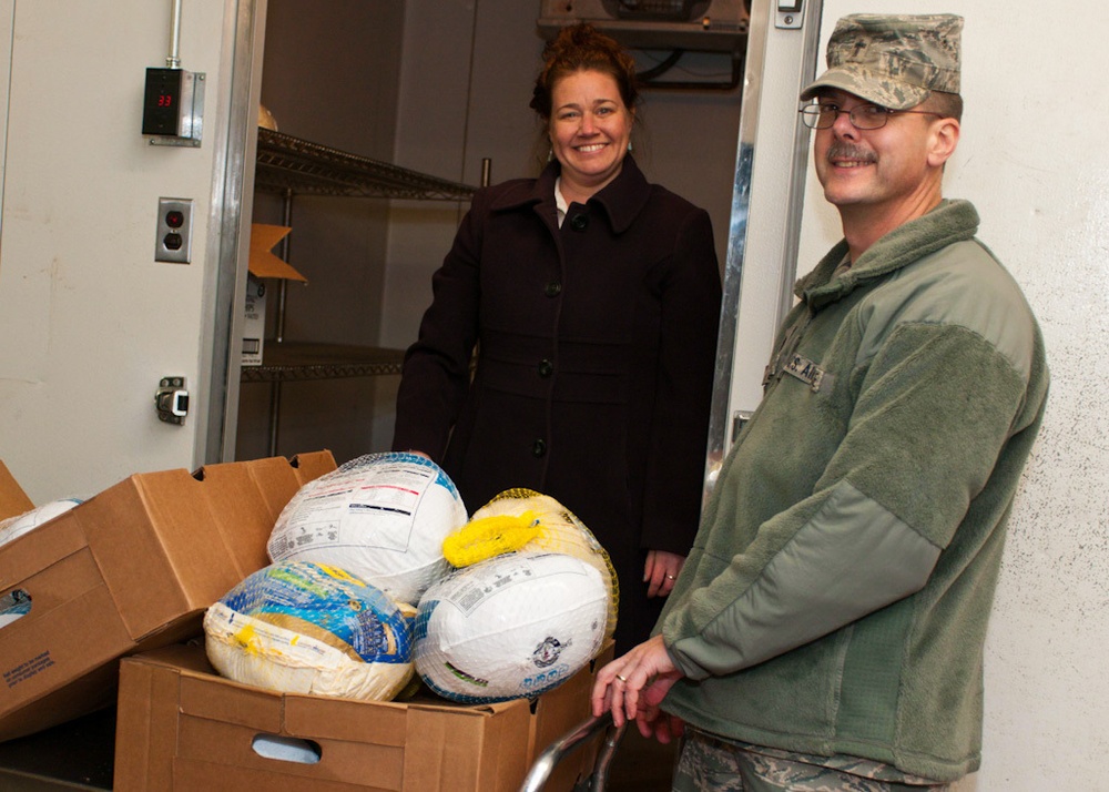 Falmouth Service Center, OCAC and Chaplains donate dozens of Thanksgiving fixings to wing members