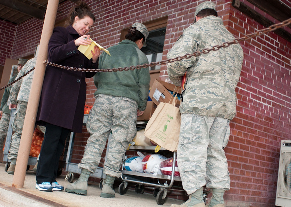 Falmouth Service Center, OCAC and Chaplains donate dozens of Thanksgiving fixings to wing members