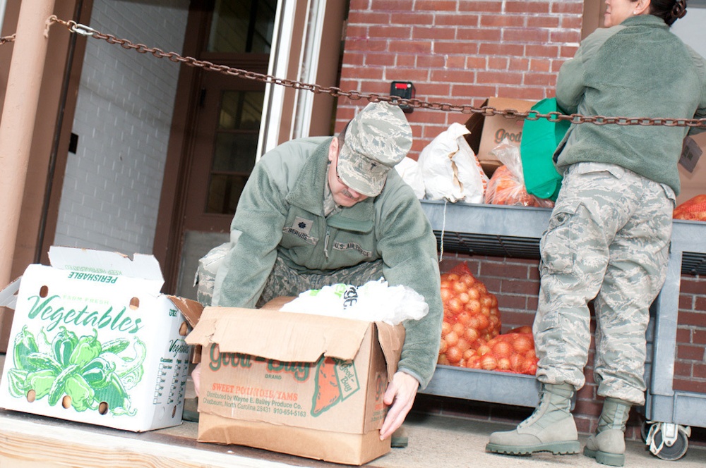 Falmouth Service Center, OCAC and Chaplains donate dozens of Thanksgiving fixings to wing members