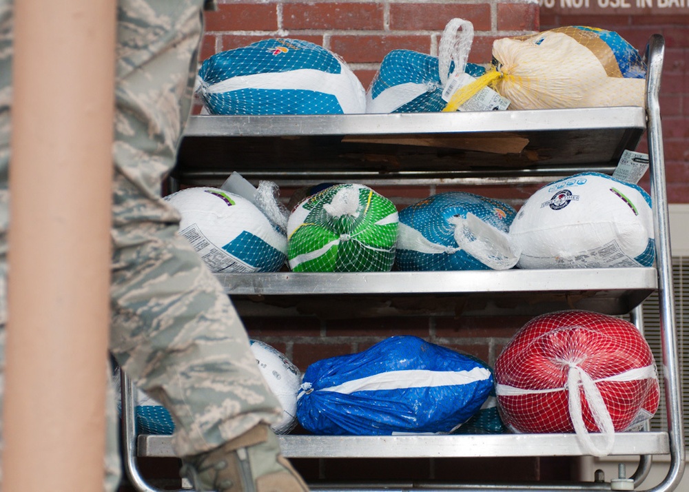 Falmouth Service Center, OCAC and Chaplains donate dozens of Thanksgiving fixings to wing members