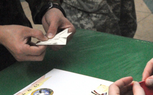 JGSDF members teach origami to US service members