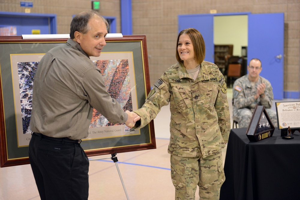 Community honors 4 contracting soldiers