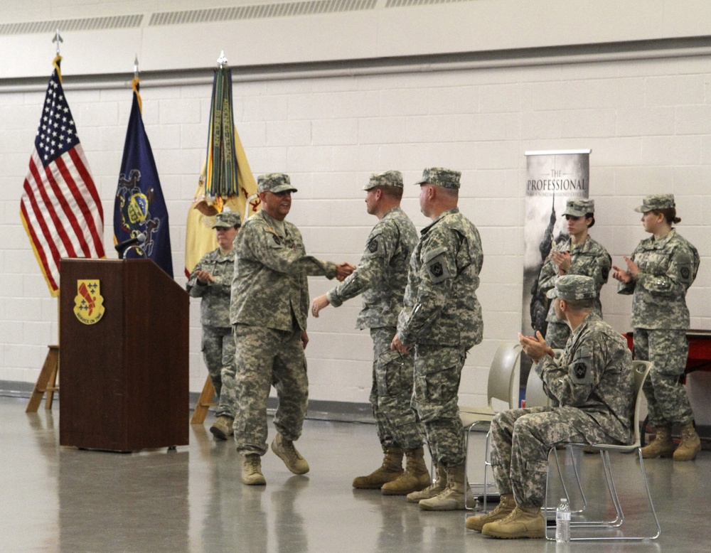 Lt. Col. Timothy A. Brooks congratulates Command Sgt. Maj. Anthony F. Mainiero during a Change Of Responsibility ceremony