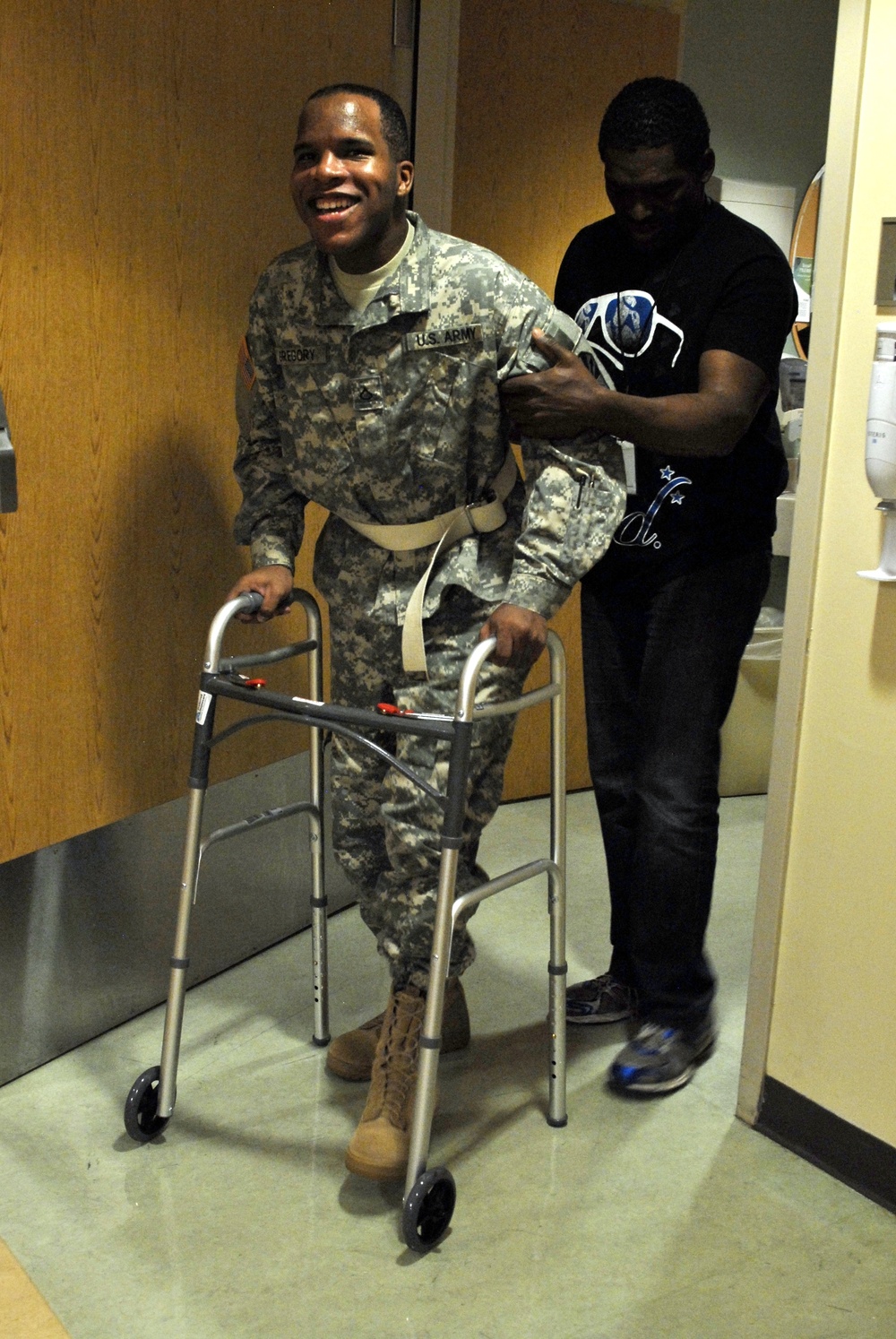 Spc. Gregory walks out of the hospital