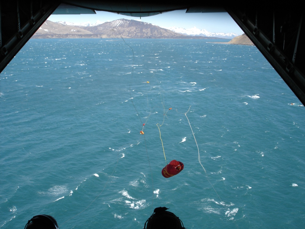 C-130 DROPPING LIFE RAFT